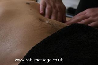 Massaging abdomen